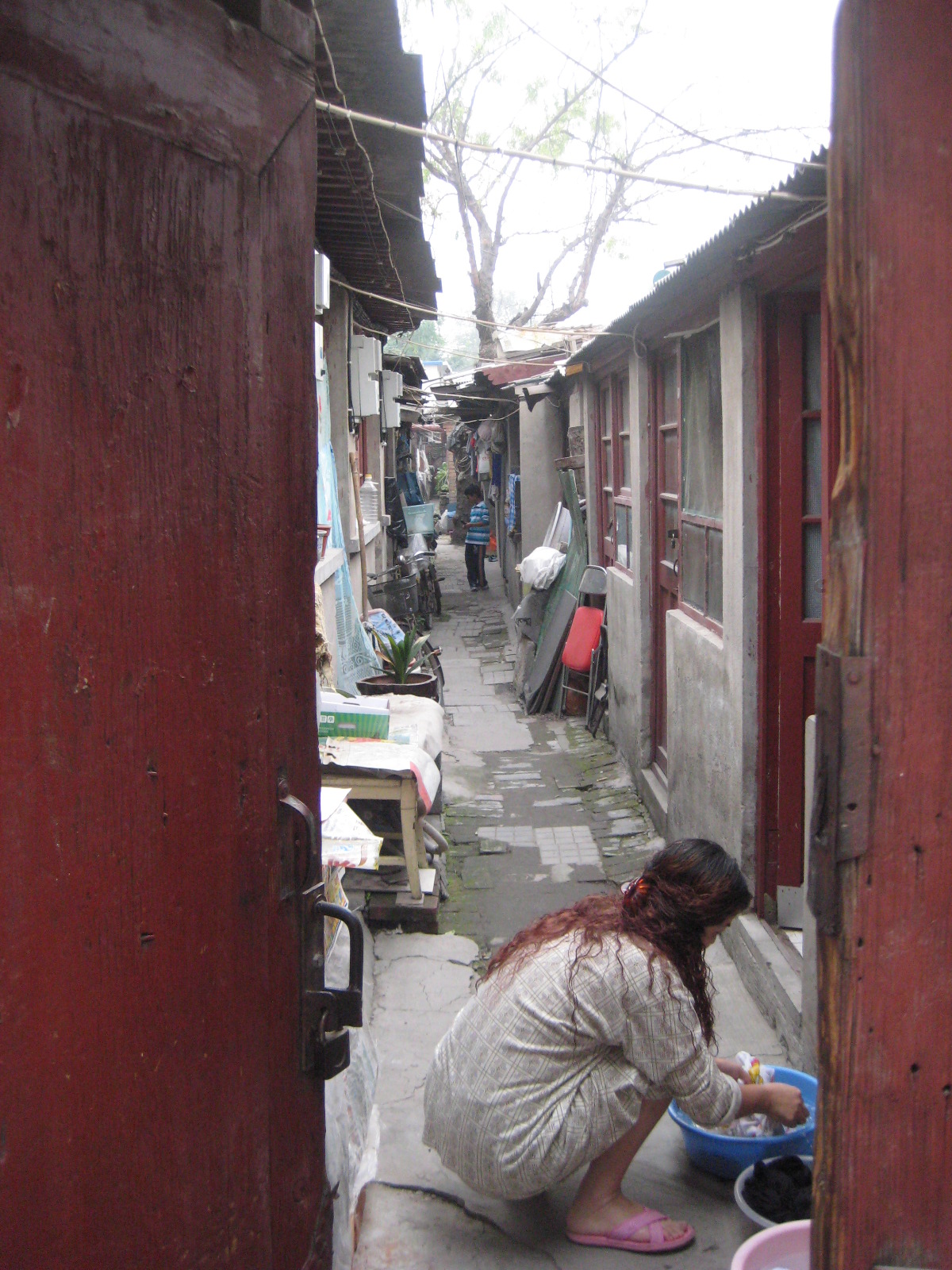 An_Unguarded_Moment_in_a_Traditional_Hutong_Alley.JPG